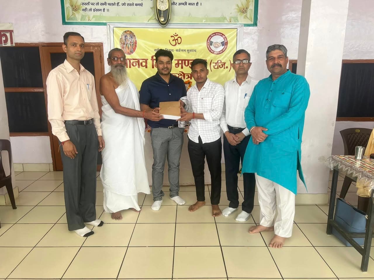 Dr. Deepak Agarwal receiving felicitation for dental care contribution